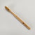 Flat lay Prana Brush Bamboo Toothbrush